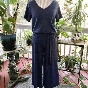 Cute jumpsuit in blue. Never worn.